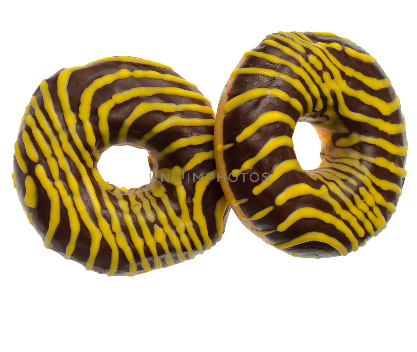 Two American donuts covered with chocolate and with yellow stripes on a white background in isolation