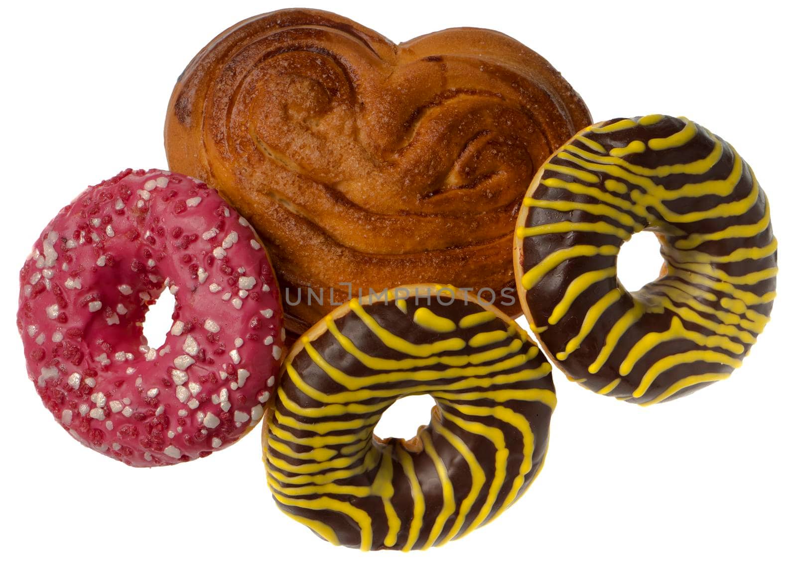 Appetizing American donuts and other pastries, on white plate isolated