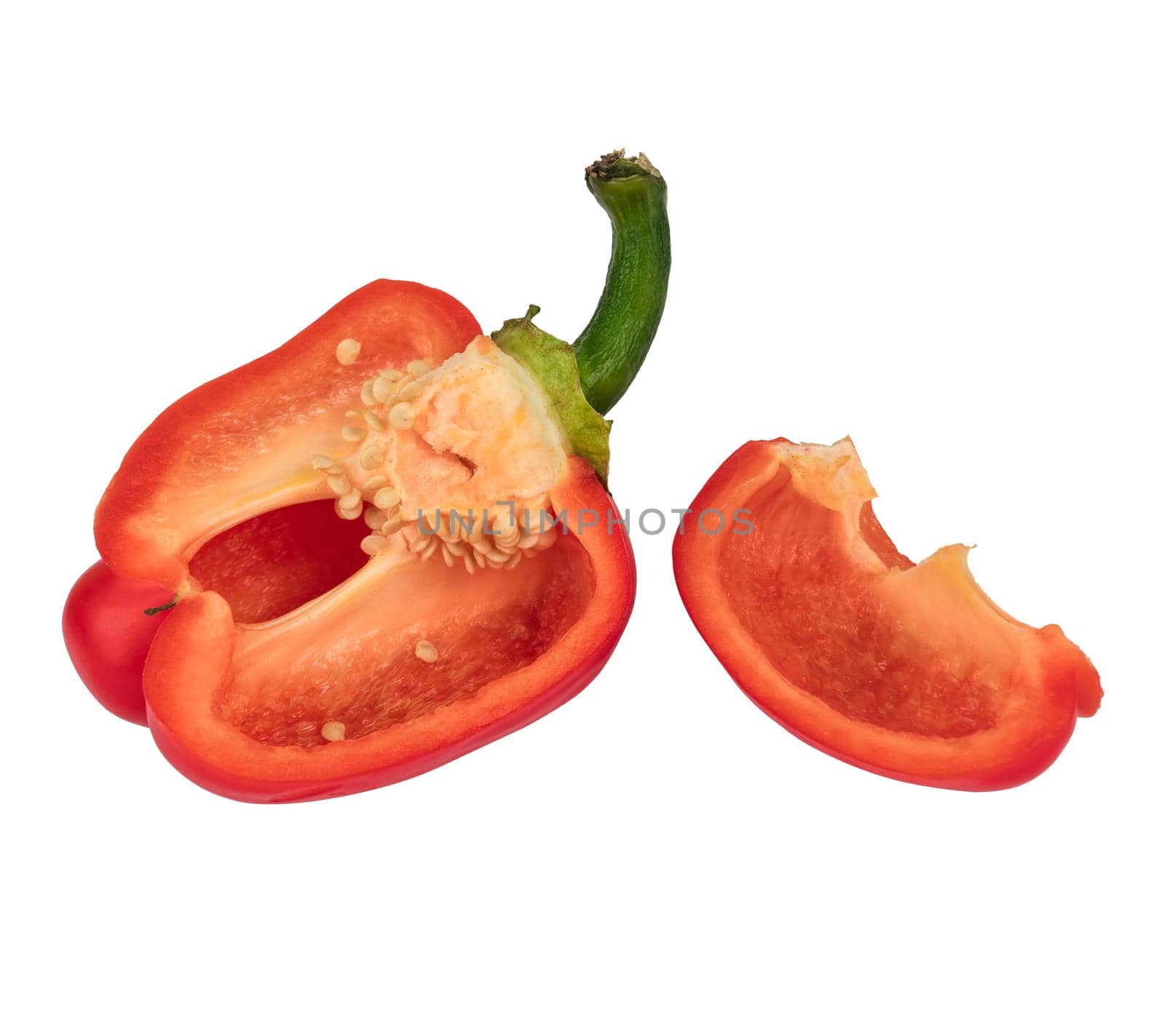 Ripe sweet red peppers, cut into pieces, on a white background