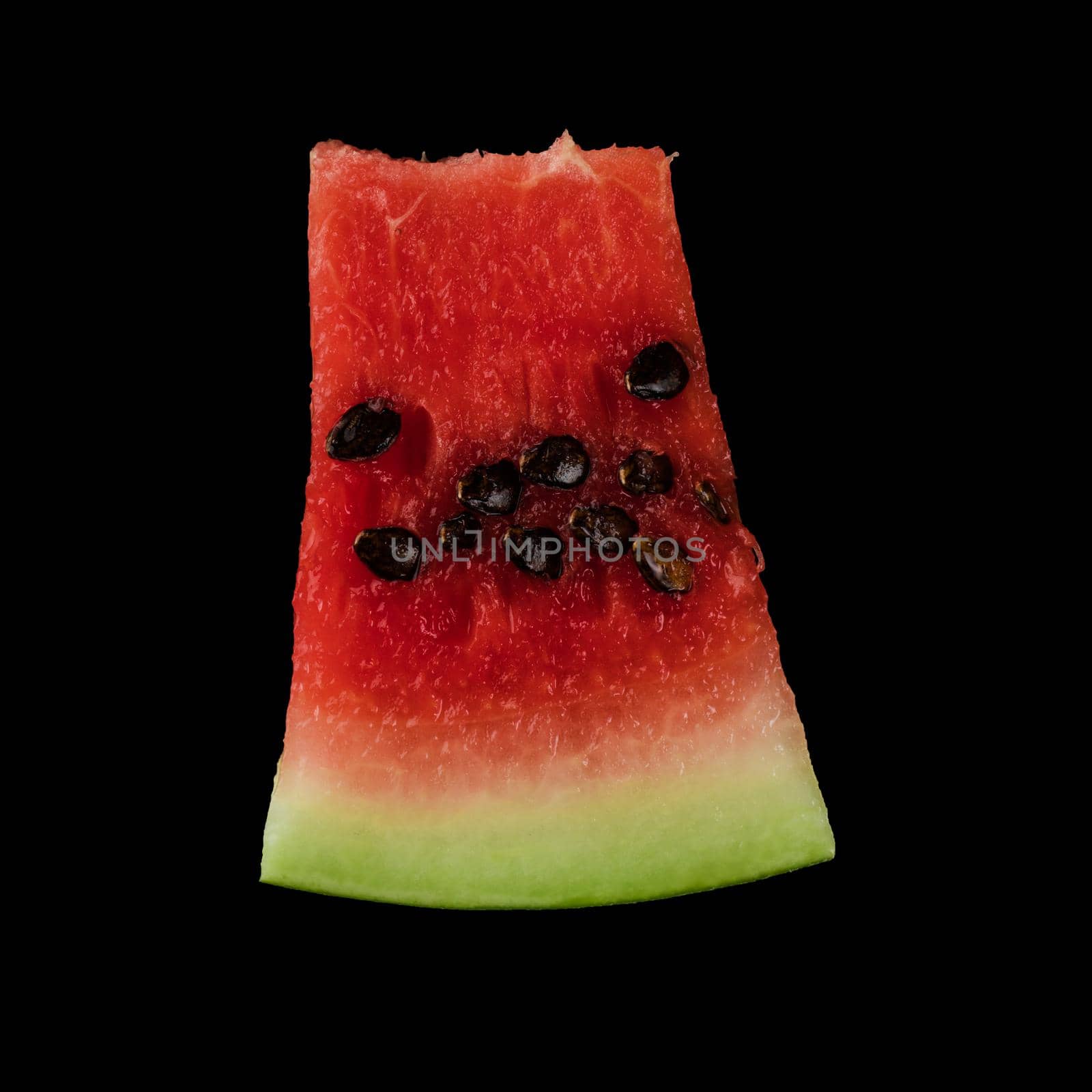 Piece of ripe watermelon, on black background, isolated