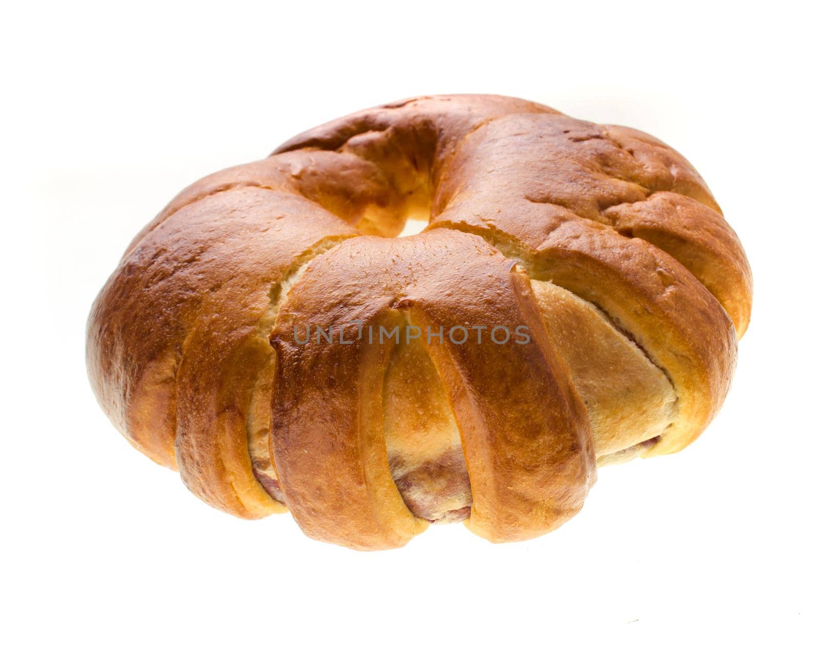 confectionery rosy bun, side view, on a white background