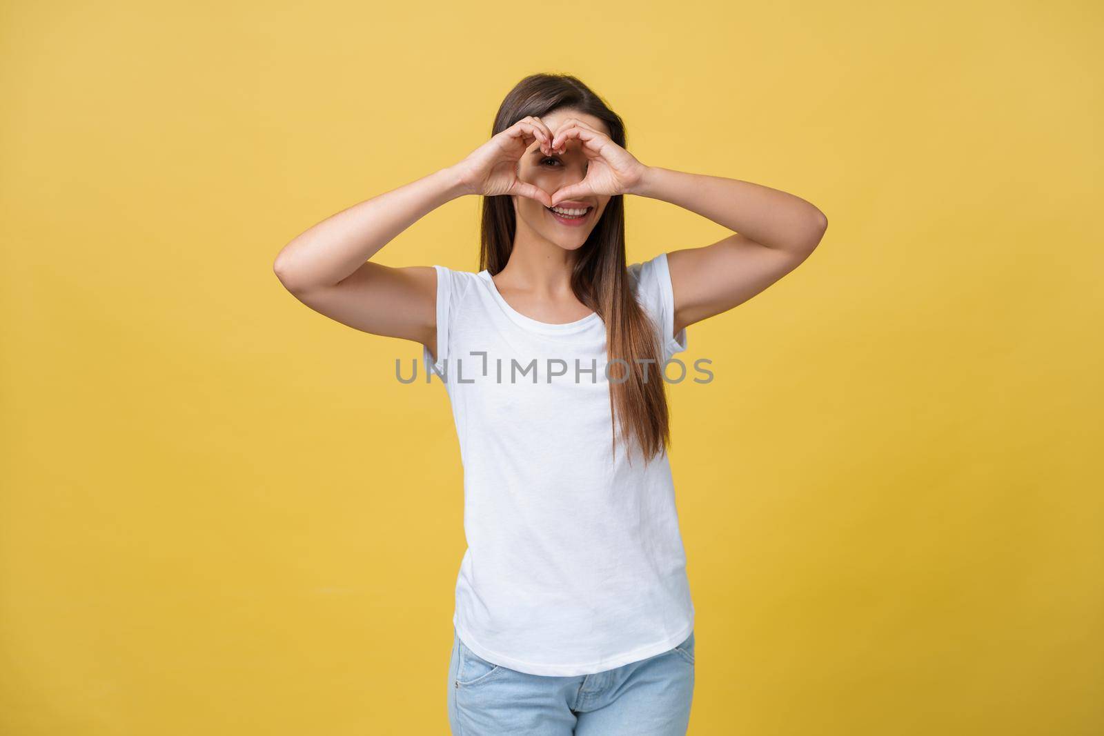 Healthy Eyes And Vision. Portrait Of Beautiful Happy Woman Holding Heart Shaped Hands Near Eyes. Closeup Of Smiling Girl With Healthy Skin Showing Love Sign. Eyecare. High Resolution Image. by Benzoix