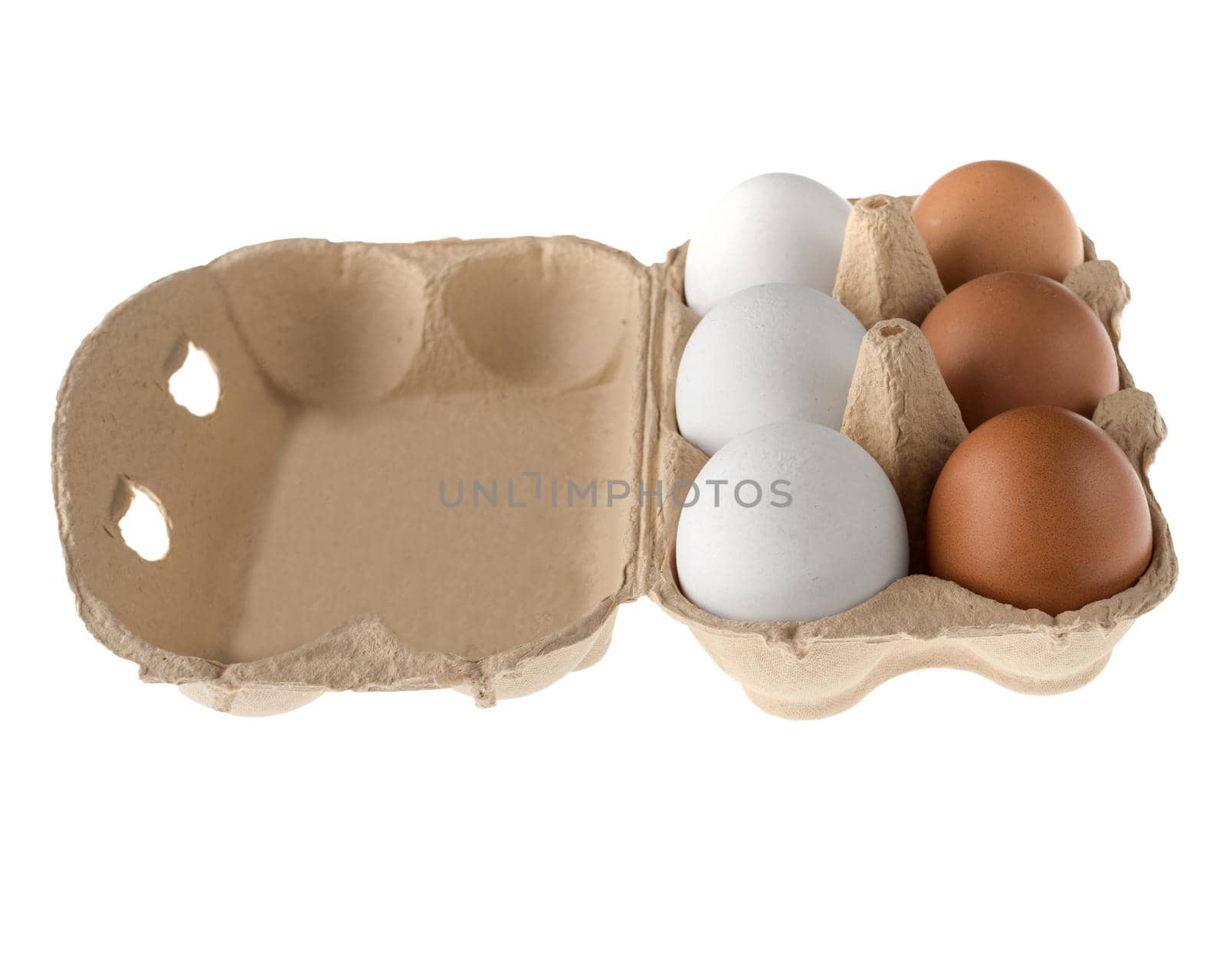 Chicken eggs in a paper disposable tray, in the amount of six pieces, on a white background in isolation