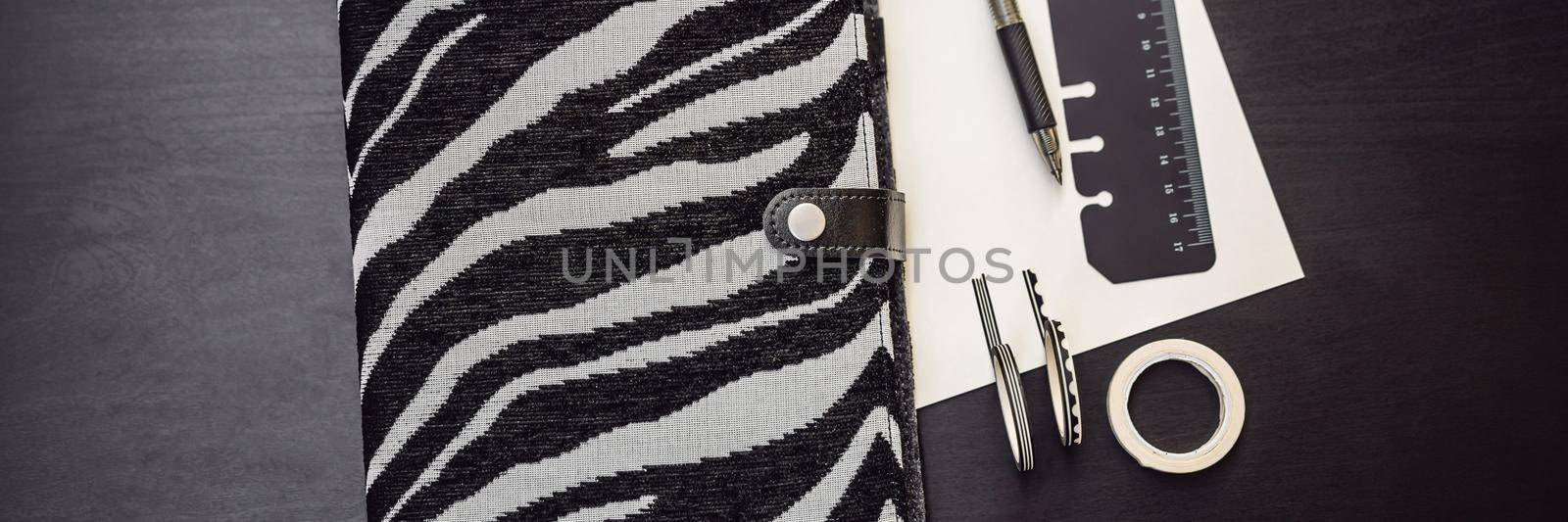 Notepad and stationery on a black background. Planner for business and study. Fans of stationery BANNER, LONG FORMAT by galitskaya