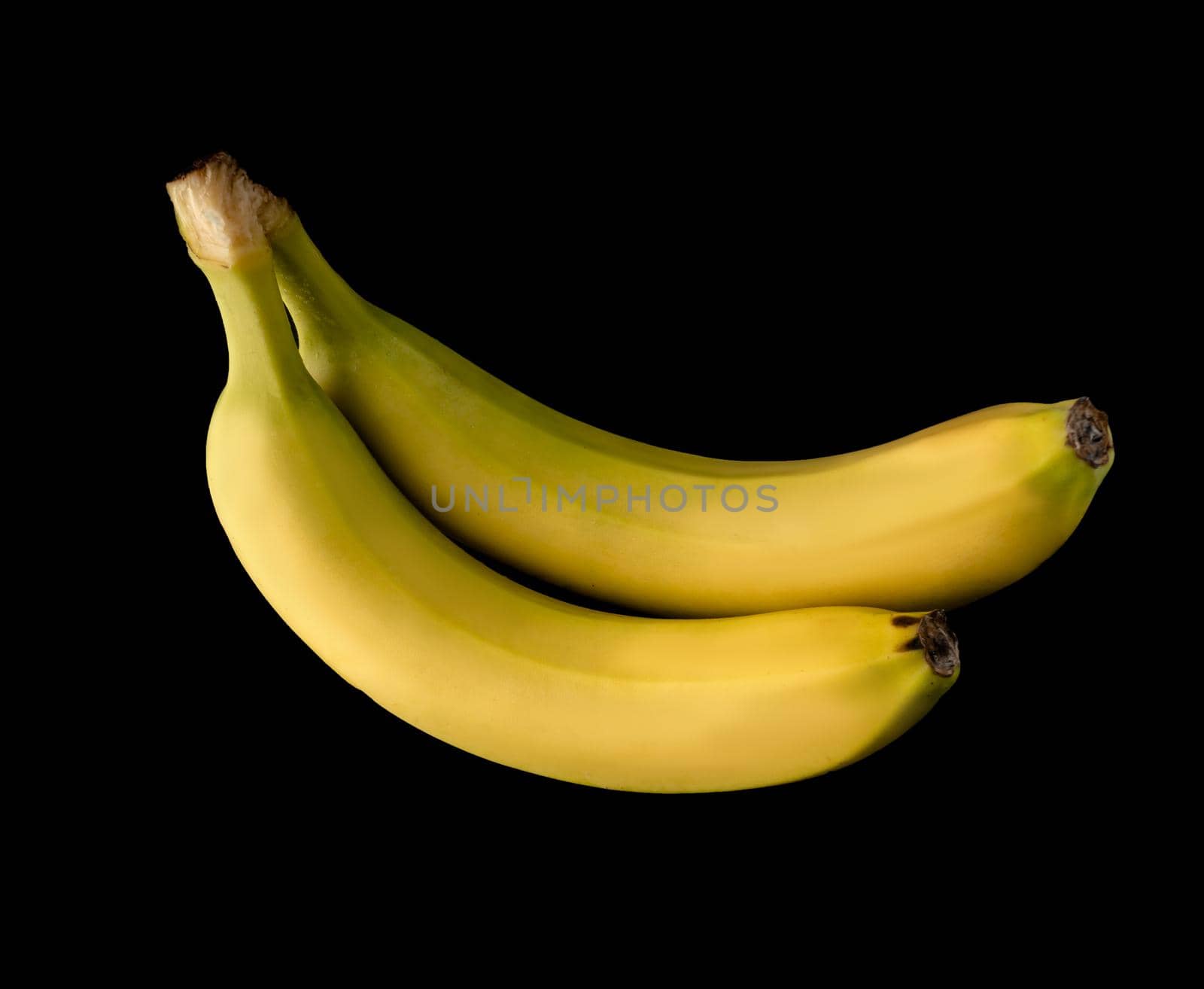 Bunch of two ripe bananas isolated on black background