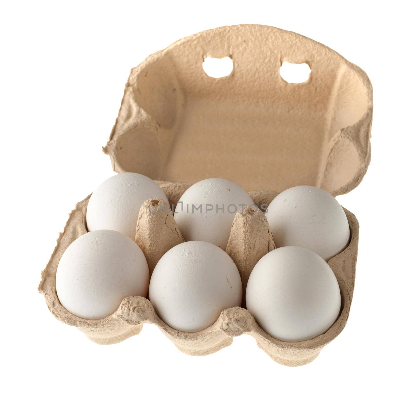 Chicken eggs in a paper disposable tray, in the amount of six pieces, on a white background in isolation