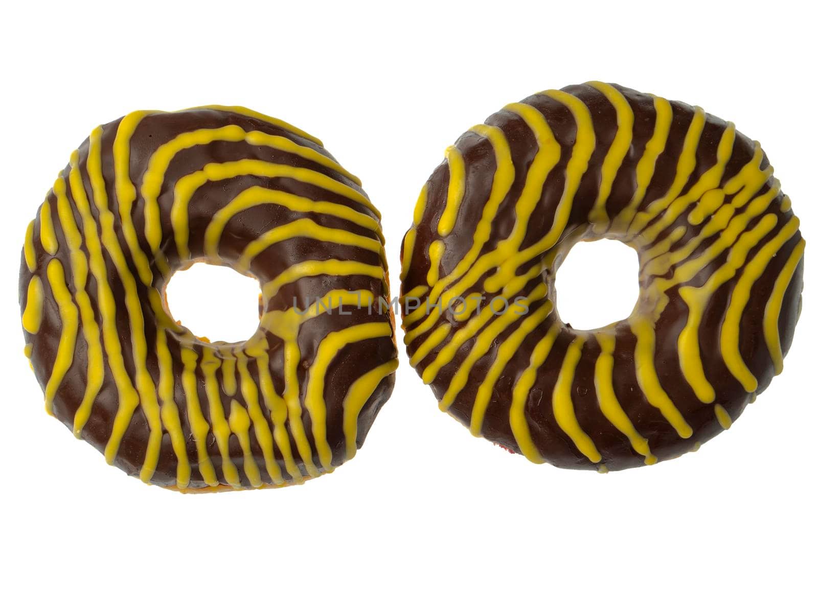 Two American donuts covered with chocolate and with yellow stripes on a white background in isolation