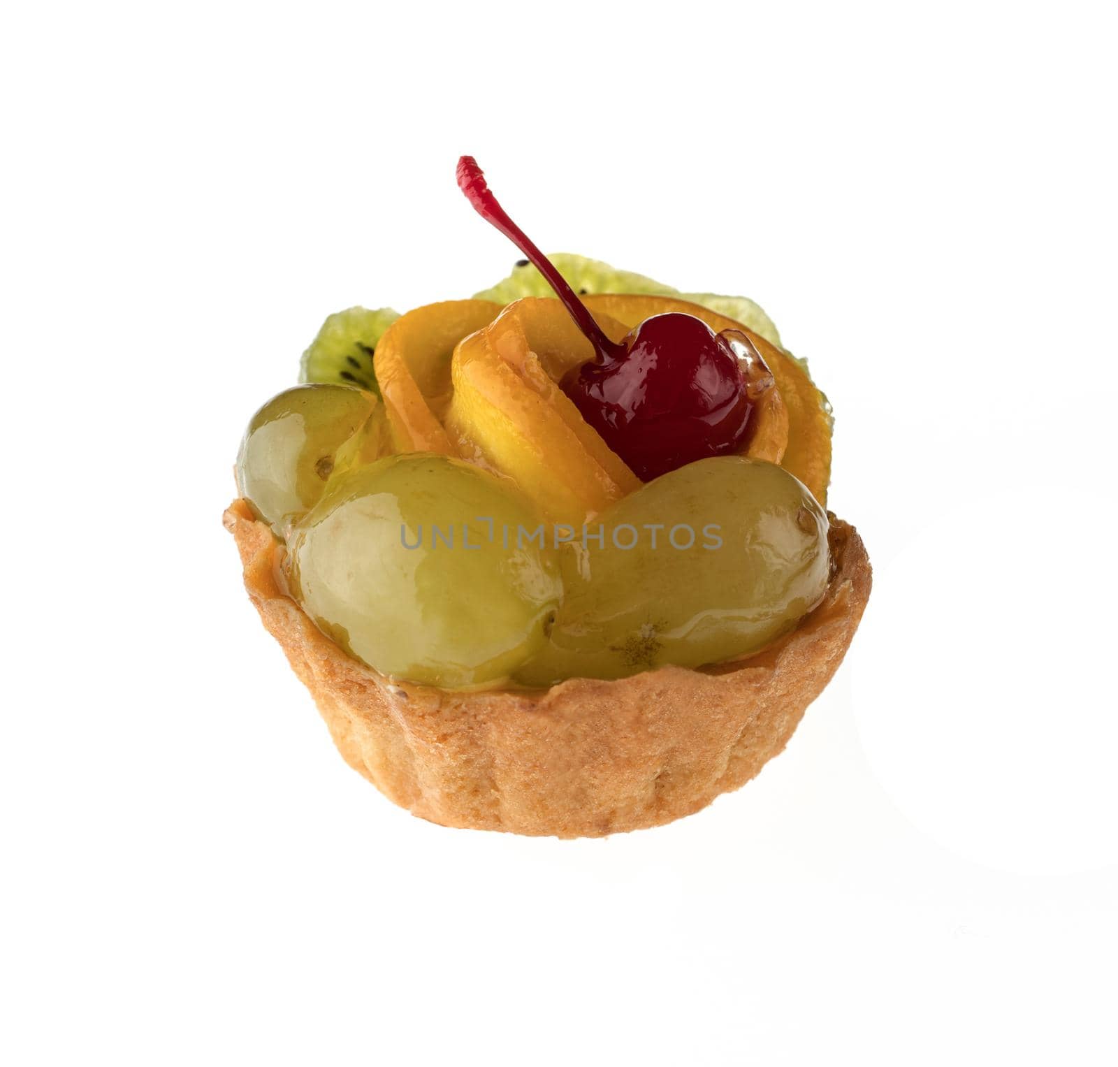 Dessert, fruit cake, with cherry grapes and orange slices, on a white background in isolation