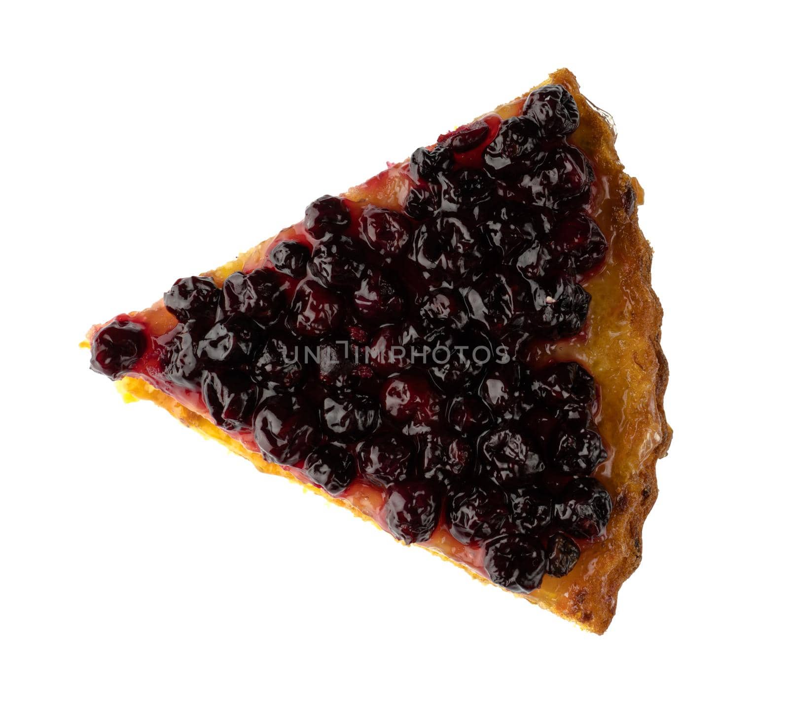 Sliced piece of carrot pie, sprinkled with currant berries on top, on white background