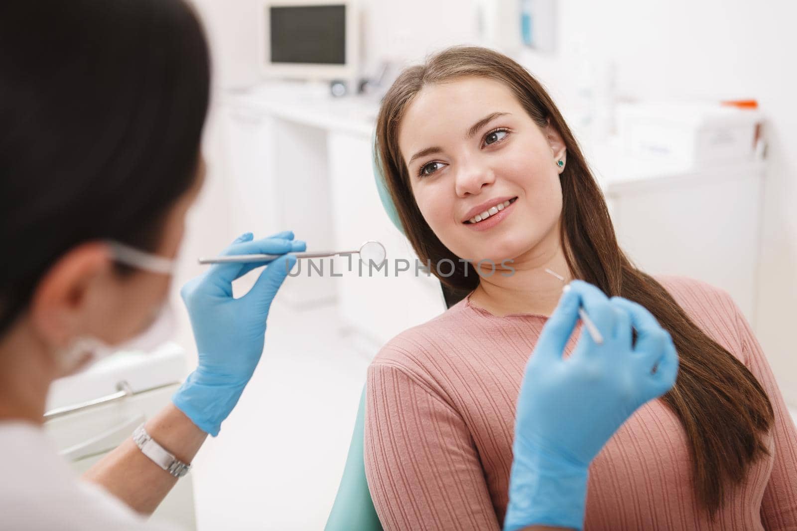 Female patient at dental clinic by MAD_Production