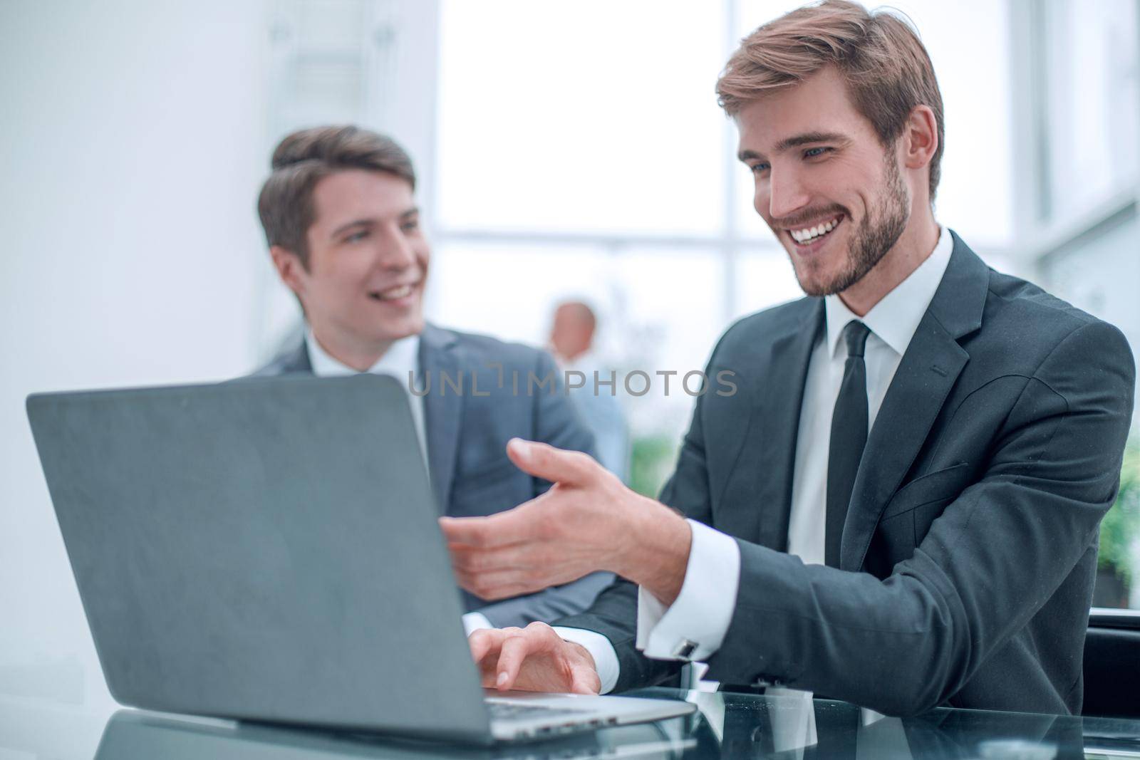 close up. two business men discussing online information. people and technology