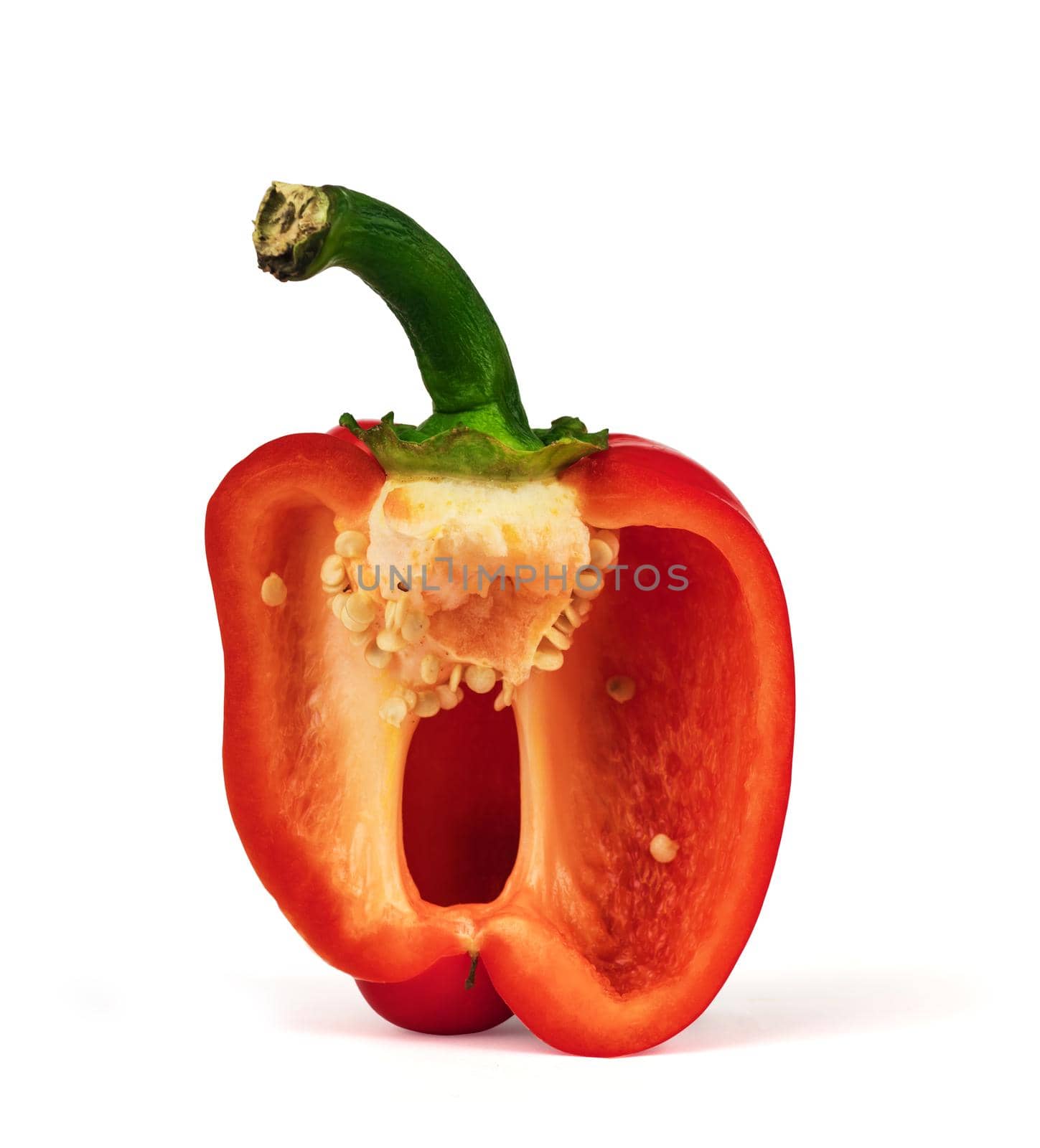 sliced piece of ripe red sweet pepper, on white background, with shadow