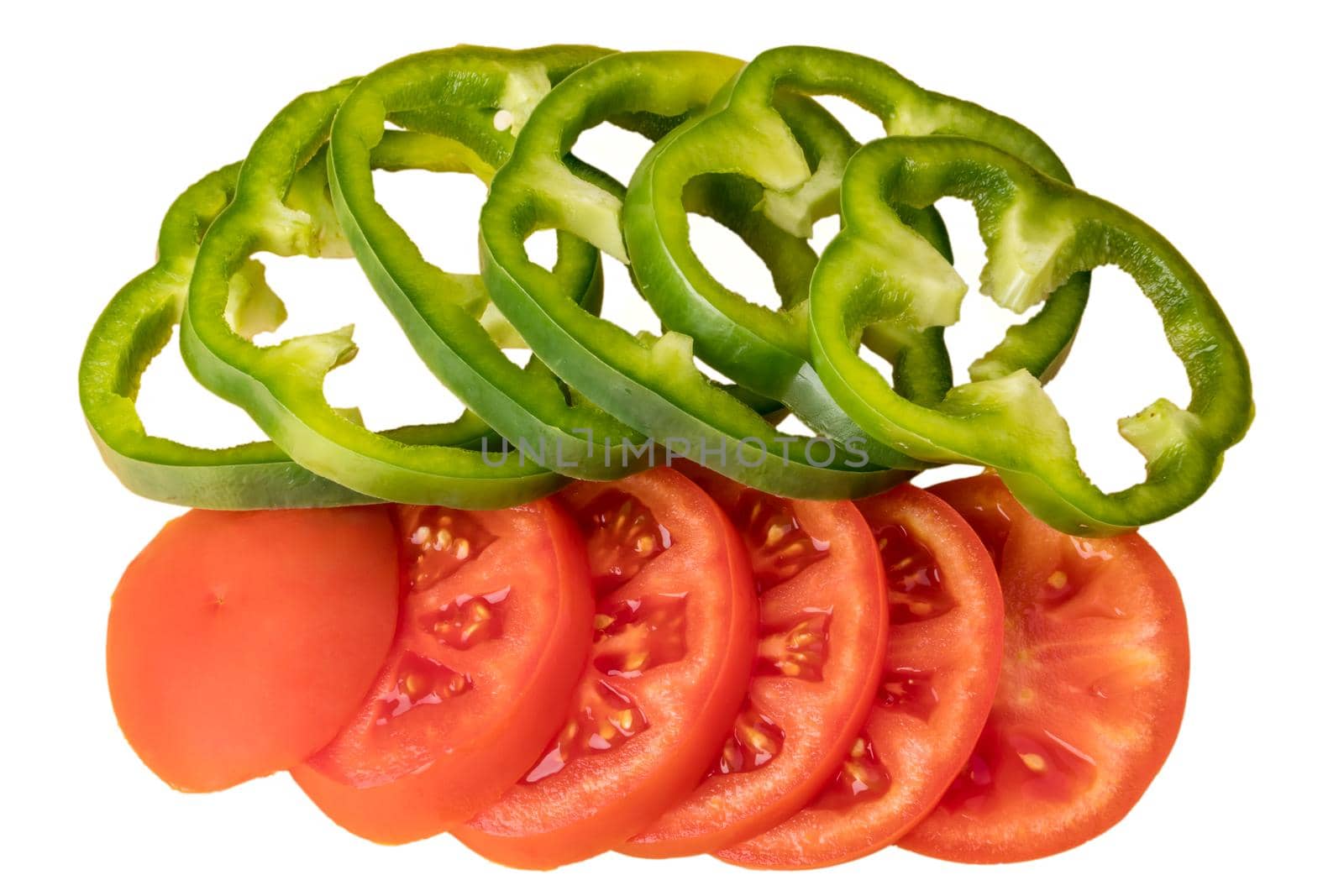 Tomatoes and paprika cut into slices, slices on a white background in isolation by A_A