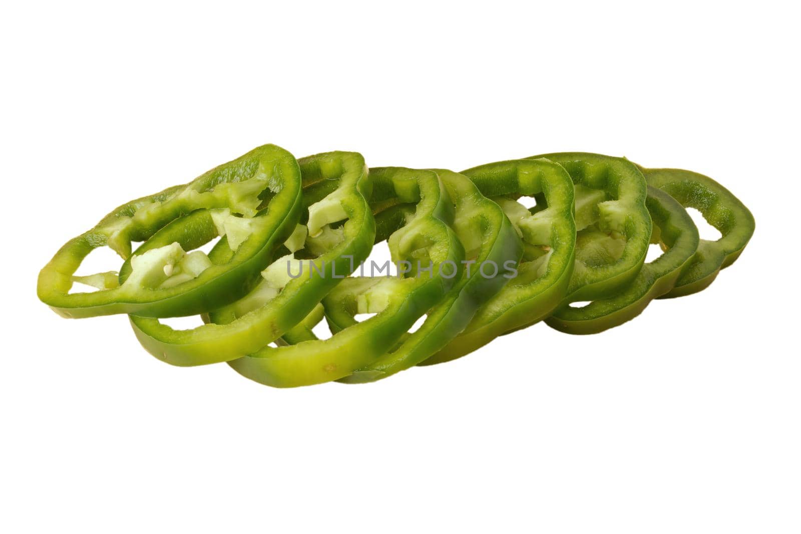 Green bell pepper sliced in pieces, slices on a white background in isolation