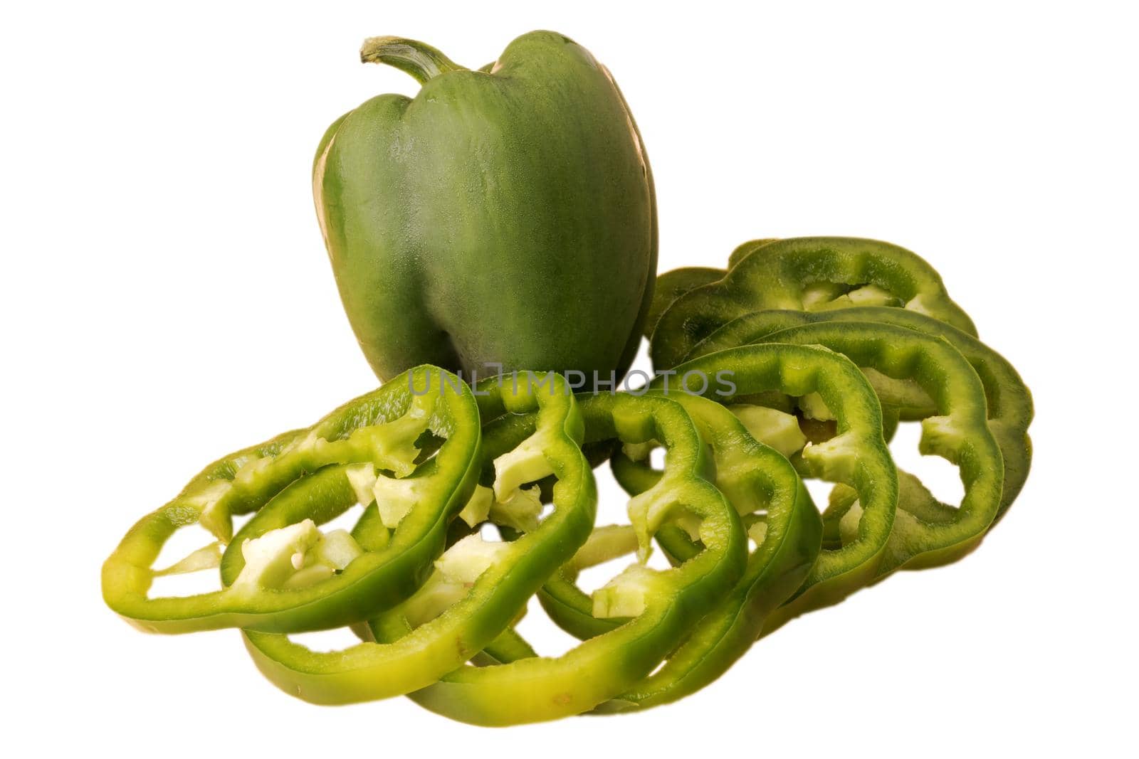 Green bell pepper, whole and sliced, on a white background in isolation by A_A