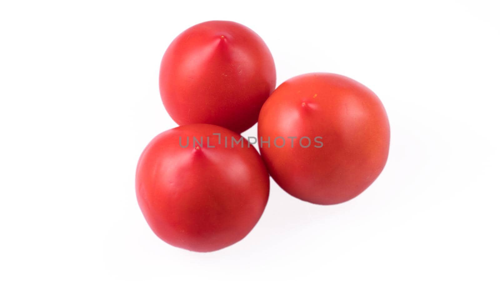 Three whole tomatoes on a white background in isolation by A_A
