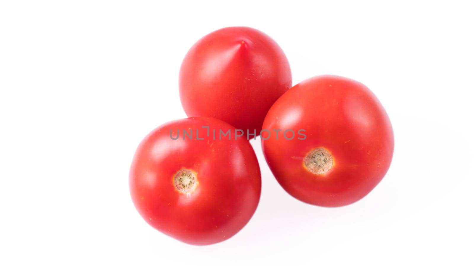 Three whole tomatoes on a white background in isolation by A_A