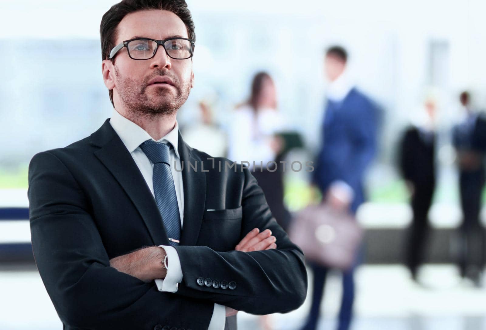 Businessman standing near the window and looking into it.photo with copy space