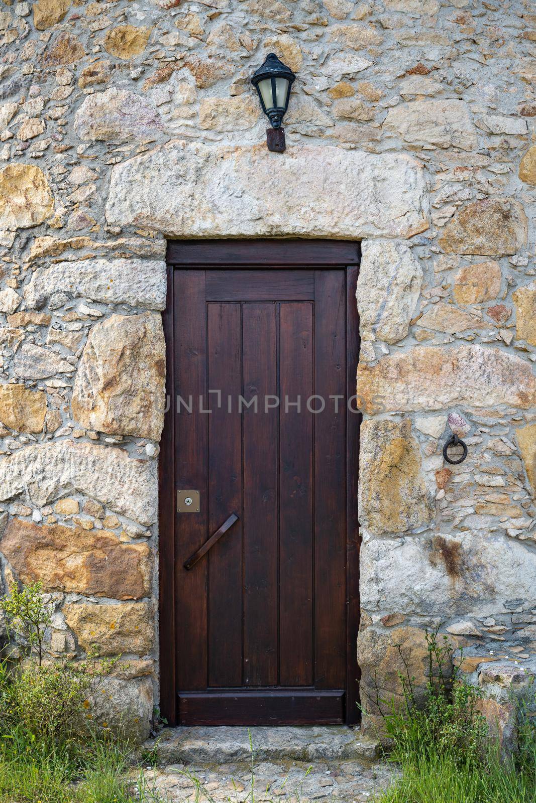 Old wooden door and stone wall by homydesign
