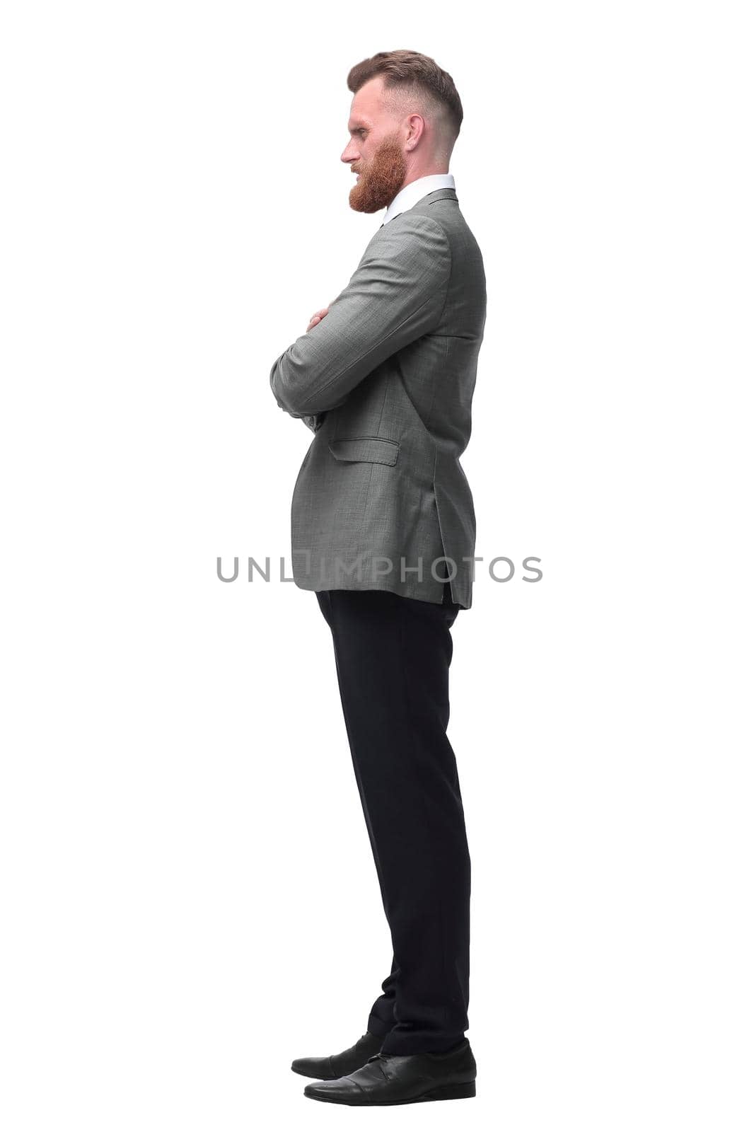 side view. a confident businessman looks forward on the copy space. isolated on white background