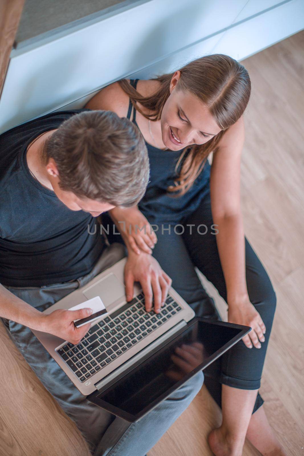 close up. a young family uses a laptop for online shopping . people and technology