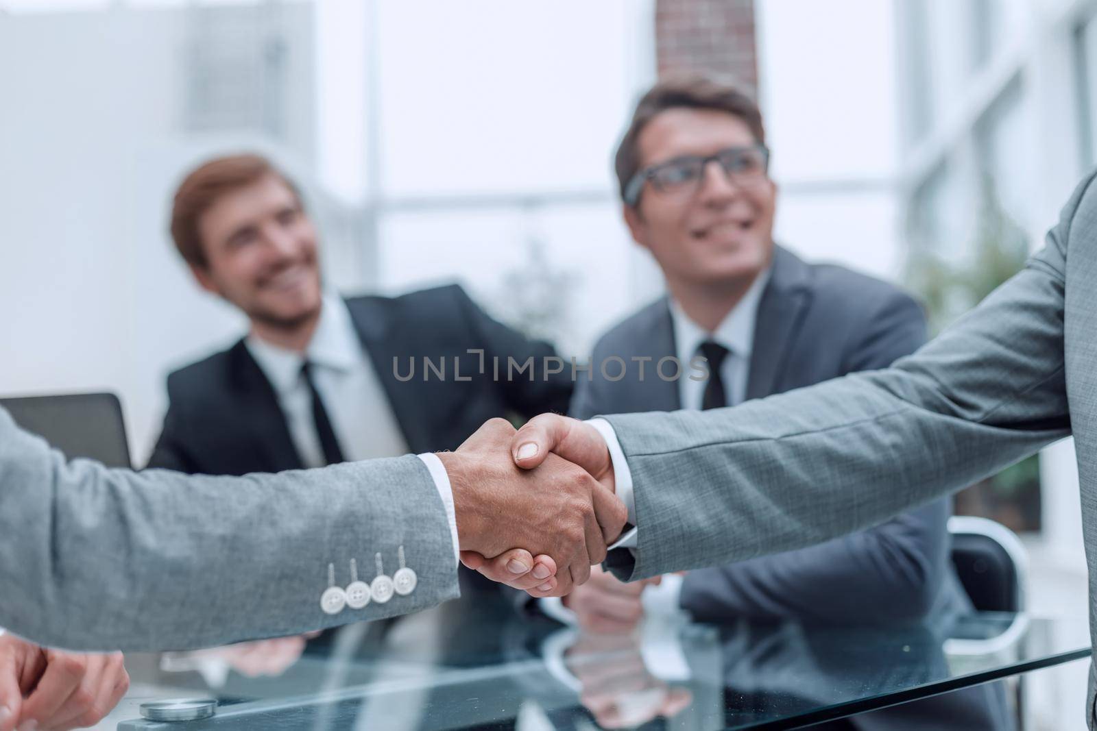 close up. handshake of business people on a blurred office background. concept of partnership