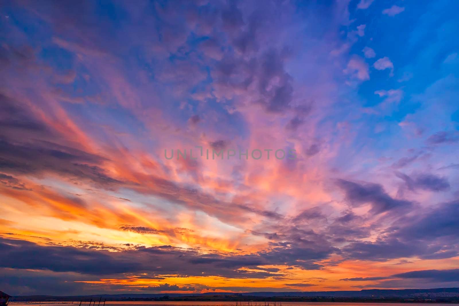 Amazing colorful clouds at the sky. Amazing view on the dramatic sunset sky by EdVal