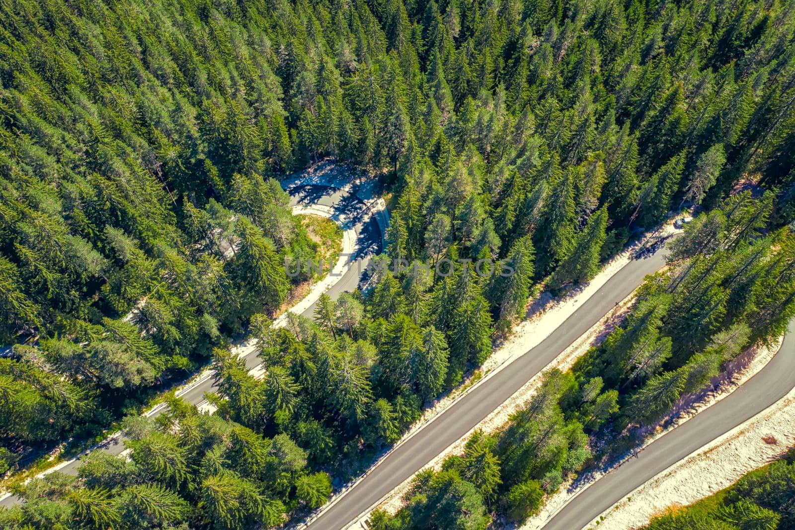 Anstract view from drone of curves of mountain road. Transportation and infrastructure concept