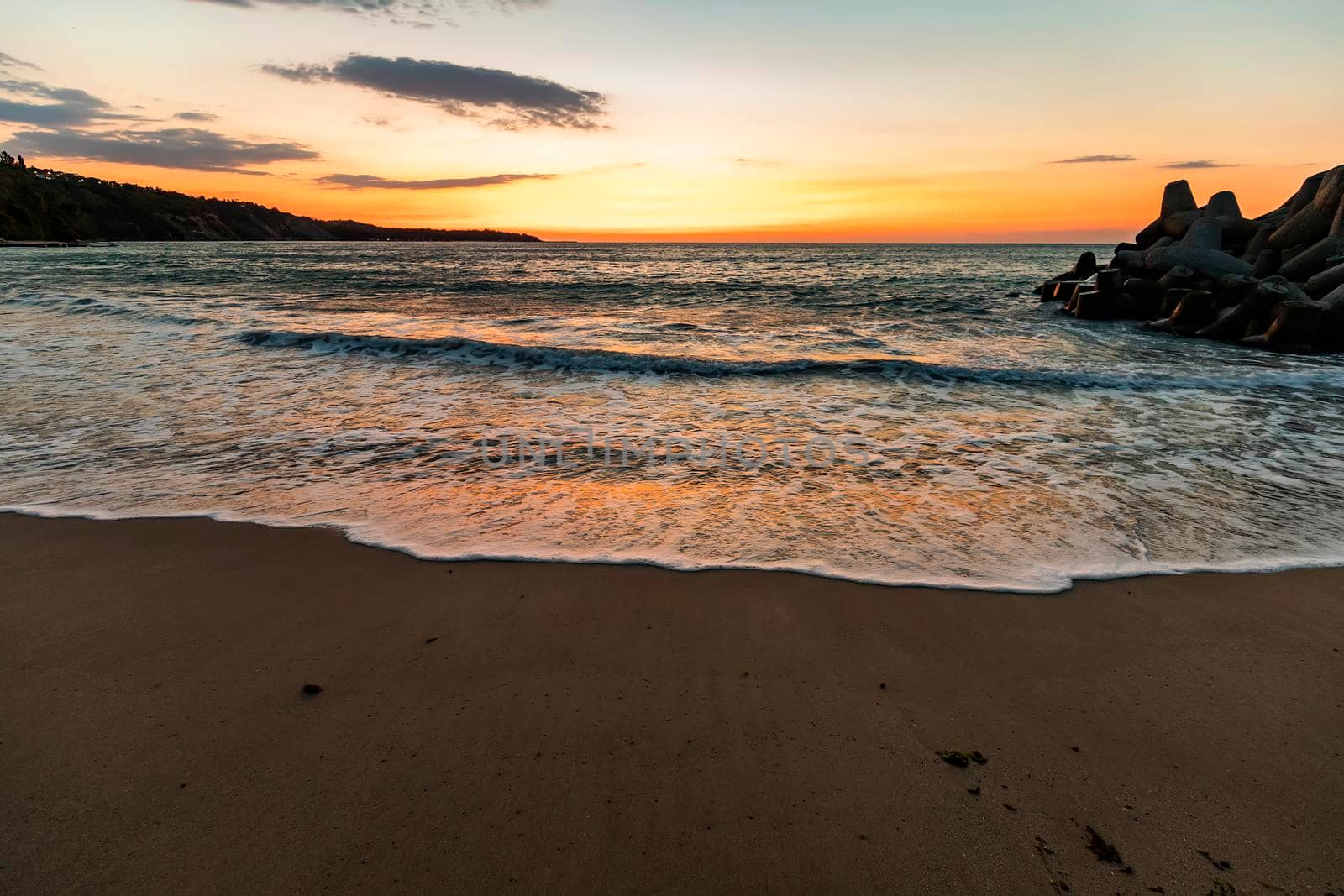 Amazing flow sea wave, wide-angle view, a beautiful view with first rays over the sea.