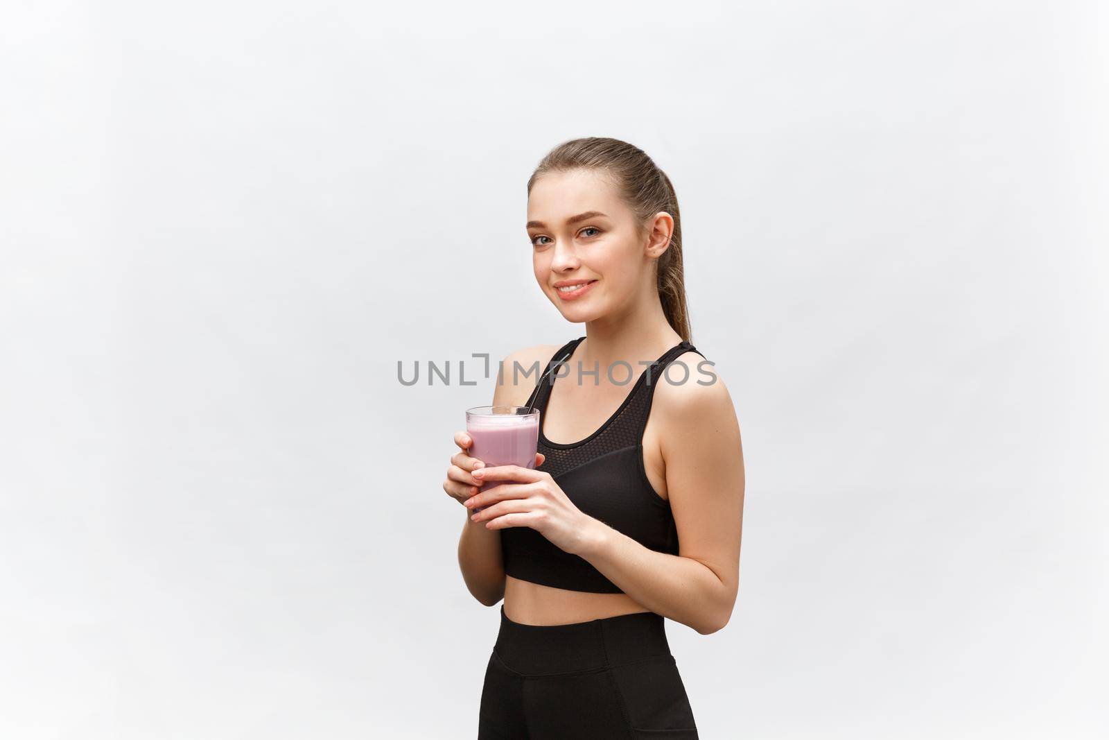 young happy woman with healthy diet shake drinking for sport and fitness