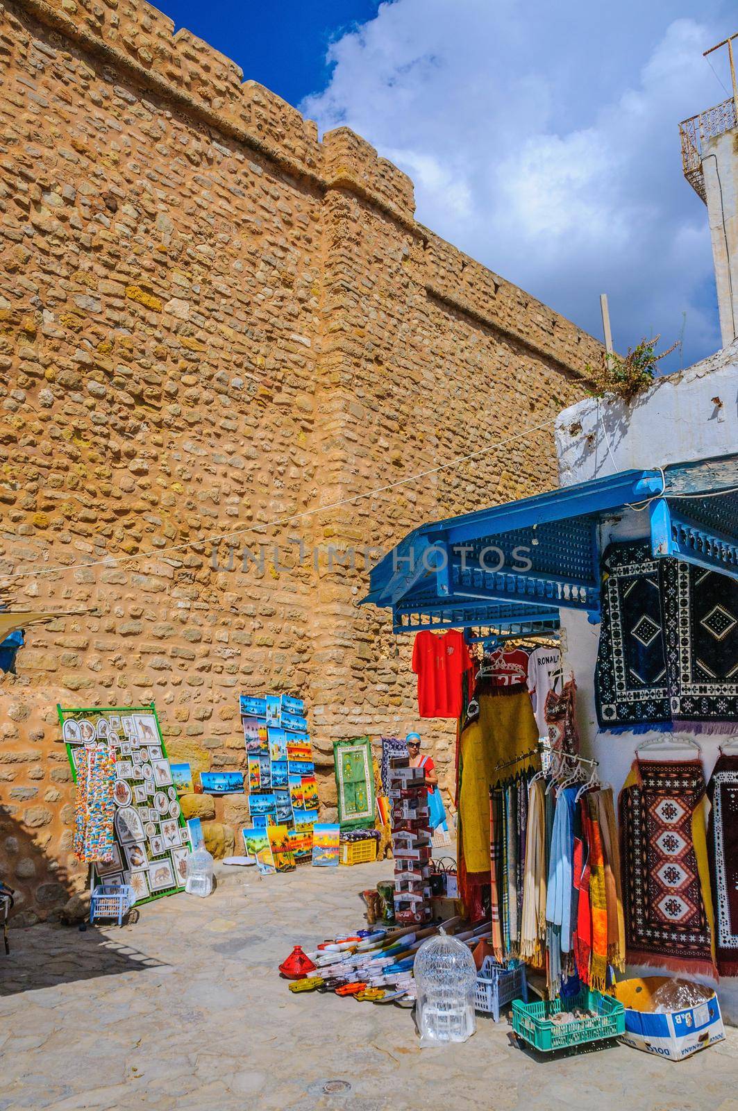 HAMMAMET, TUNISIA - Oct 2014: Stone ancient wall of Medina with bazaar on October 6, 2014 in Hammamet, Tunisia