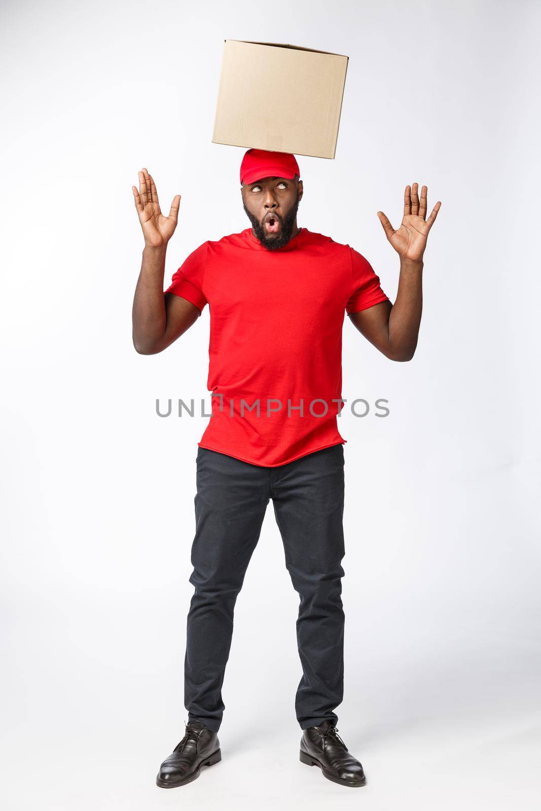 Happy African American man with a box on his head.