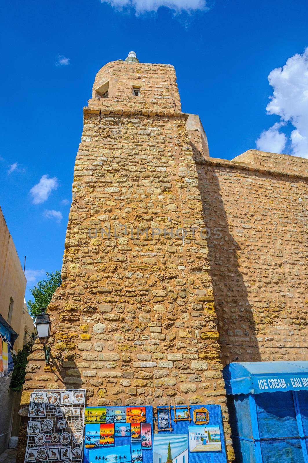 HAMMAMET, TUNISIA - Oct 2014: Stone ancient wall of Medina with bazaar on October 6, 2014 in Hammamet, Tunisia