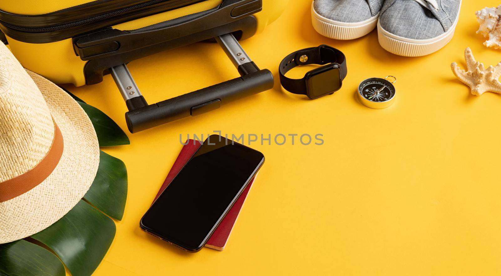 travel plan, trip and vacation, technology. Top view travel accessories with shoes, map, smartphone with mockup screen, hat. Copy space