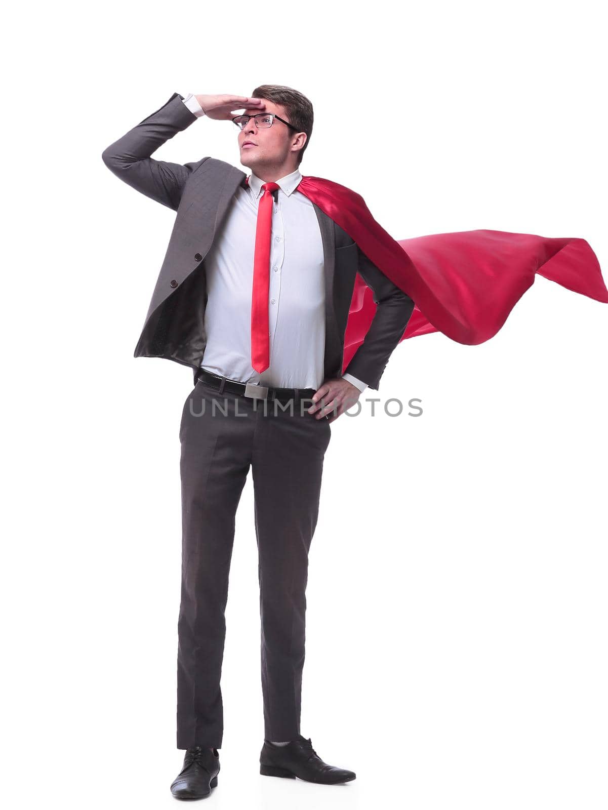 in full growth. superhero businessman looking into the distance. isolated on white