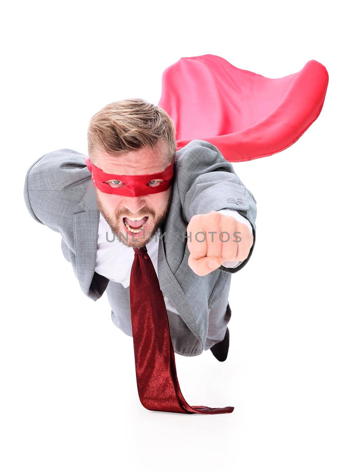 flying superhero businessman looking at the camera. isolated on white background