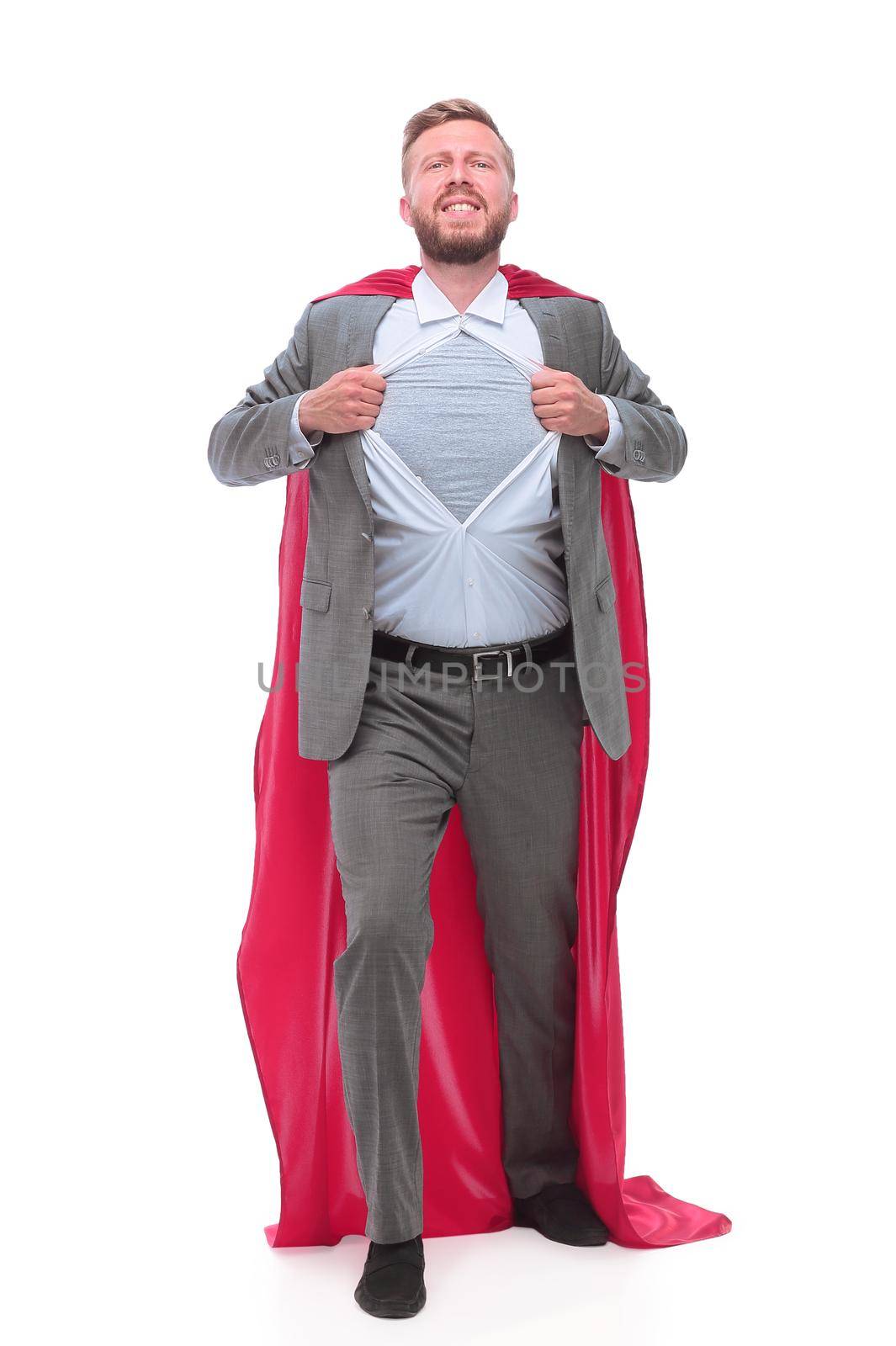 in full growth. businessman in superhero Cape rips his shirt. isolated on white