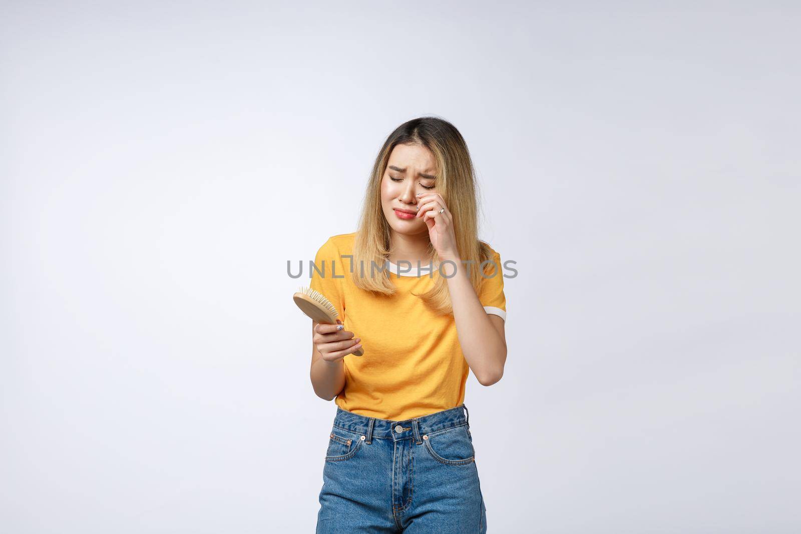 Unhappy Asian girl on the phone , Angry Asian woman talking phone with her boyfriend, isolated on white background