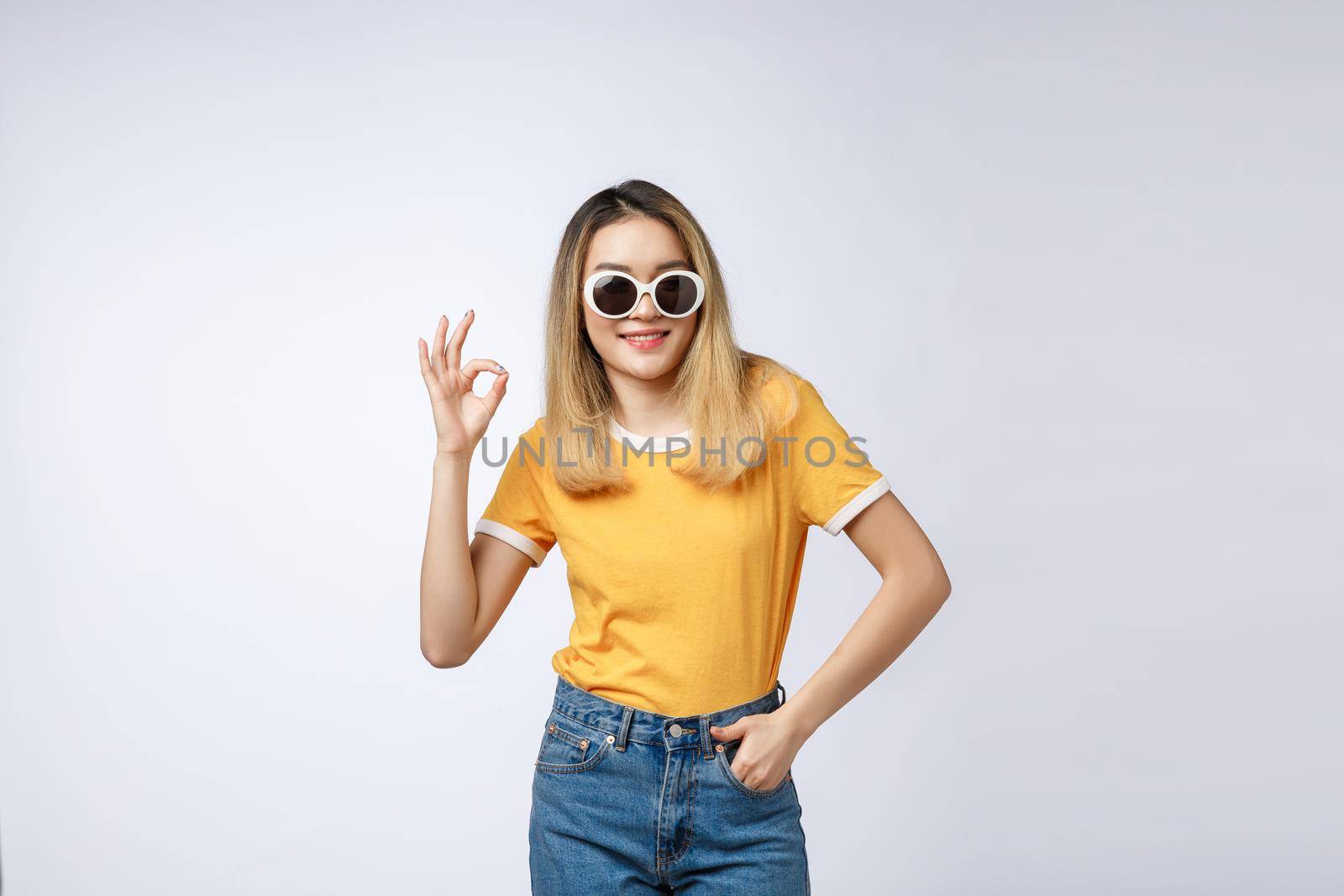 Asian young woman beautiful smile with ok finger sign isolate on white background by Benzoix