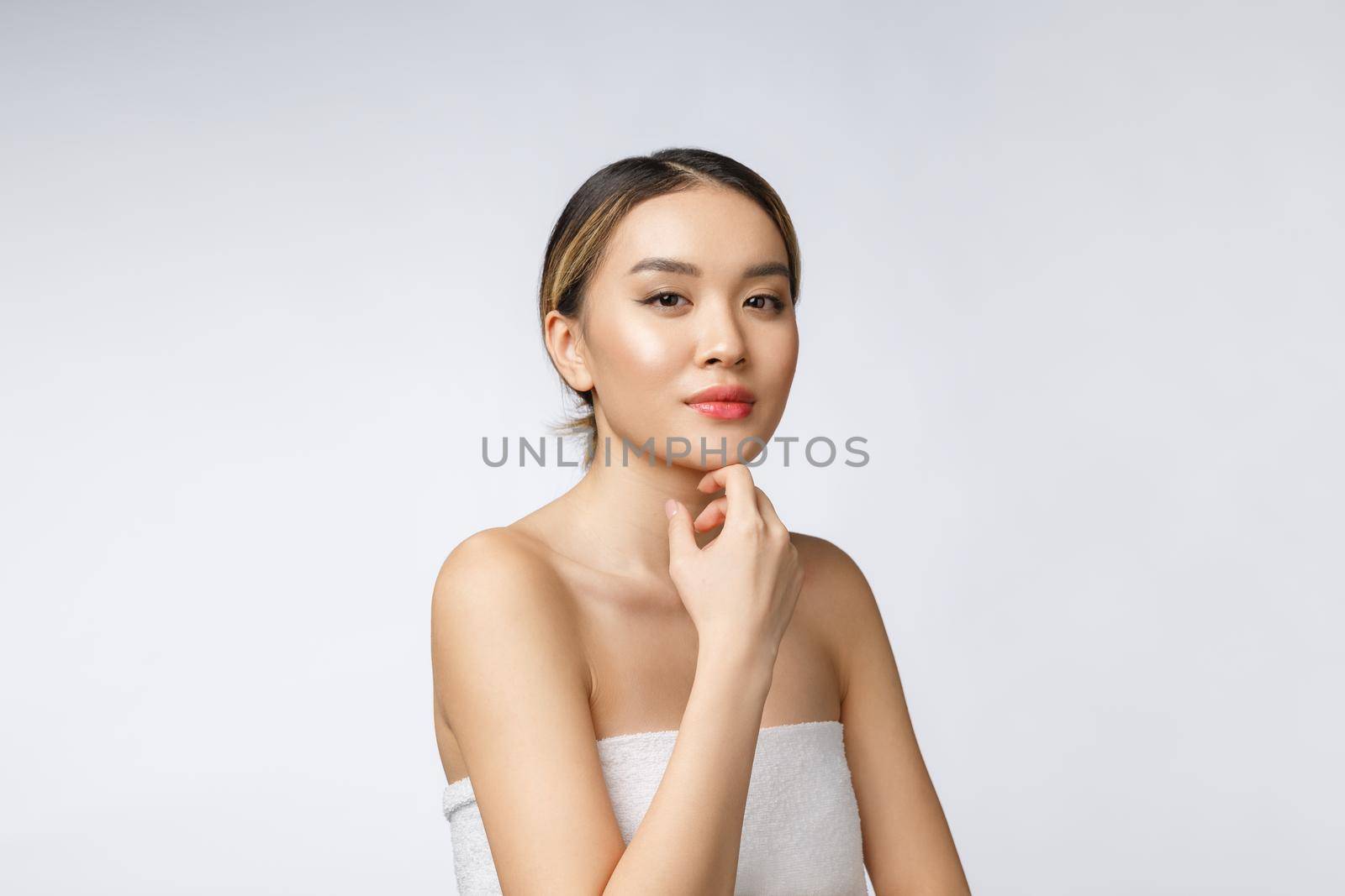Portrait of beautiful asian woman makeup of cosmetic, girl hand touch cheek,face of beauty perfect with wellness isolated on white background by Benzoix
