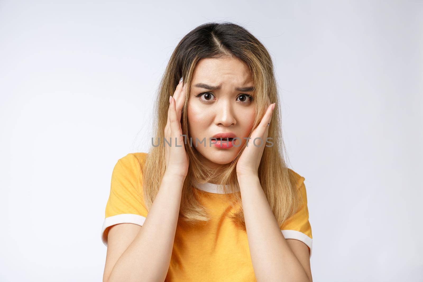 Portrait of sad crying pensive mad crazy asian woman. Closeup young asian woman isolated on white background