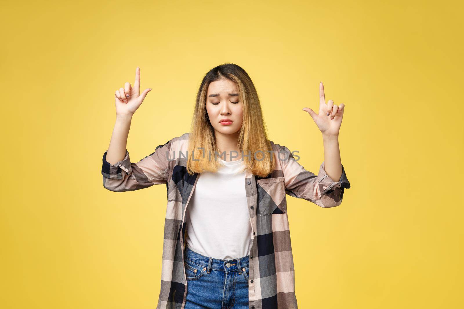 young attractive asian woman who points to the finger with unhappy emotion