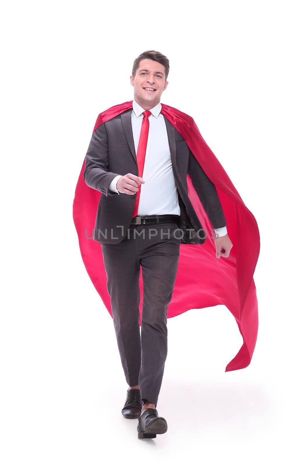 in full growth. confident businessman in superhero Cape striding forward.