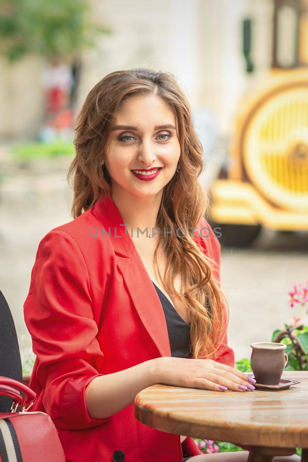 Portrait of attractive woman in cafe outdoors by okskukuruza