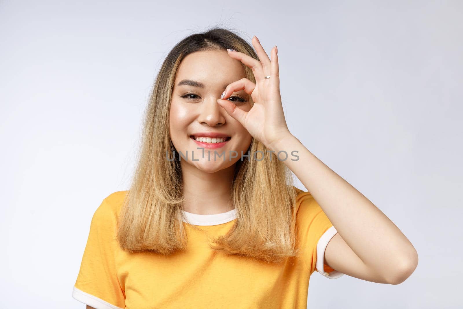 Asian young Businesswoman with ok sign gesture