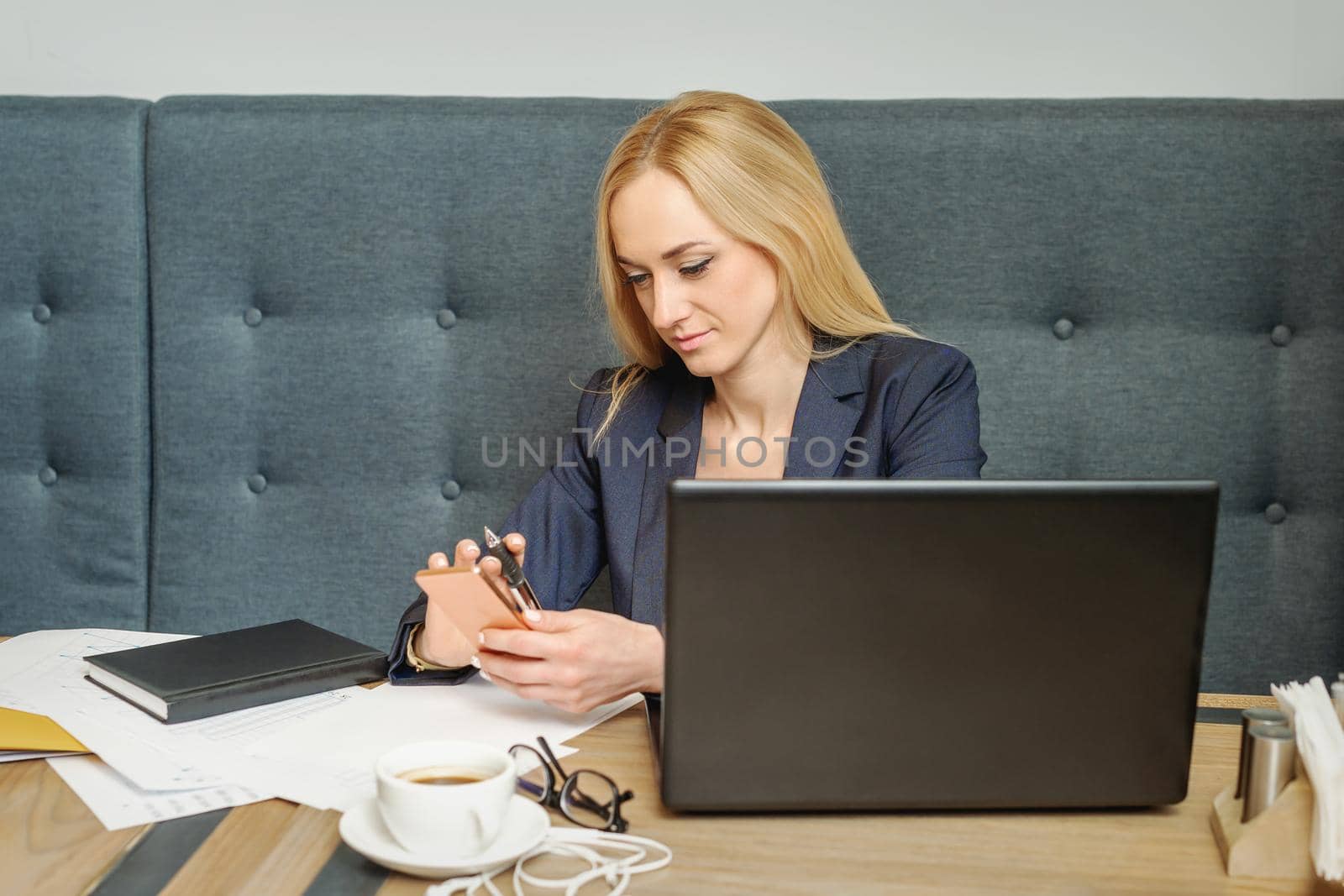 Woman is reading message on her cellphone. by okskukuruza