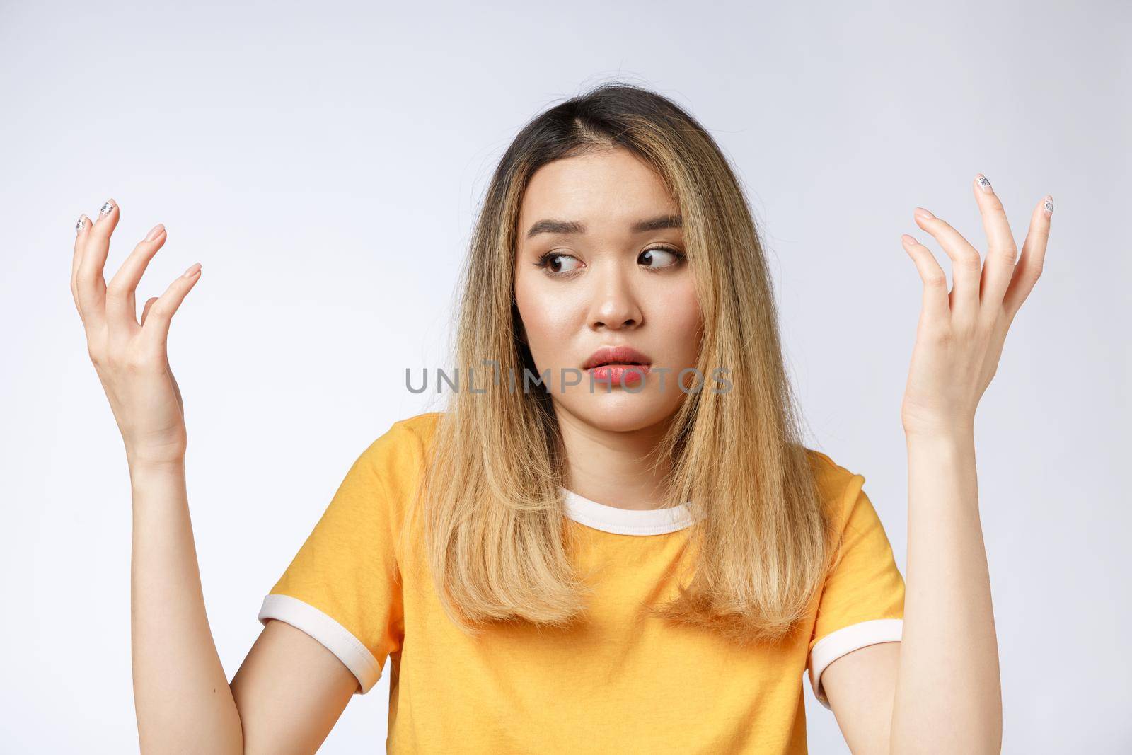 Portrait of sad crying pensive mad crazy asian woman. Closeup young asian woman isolated on white background