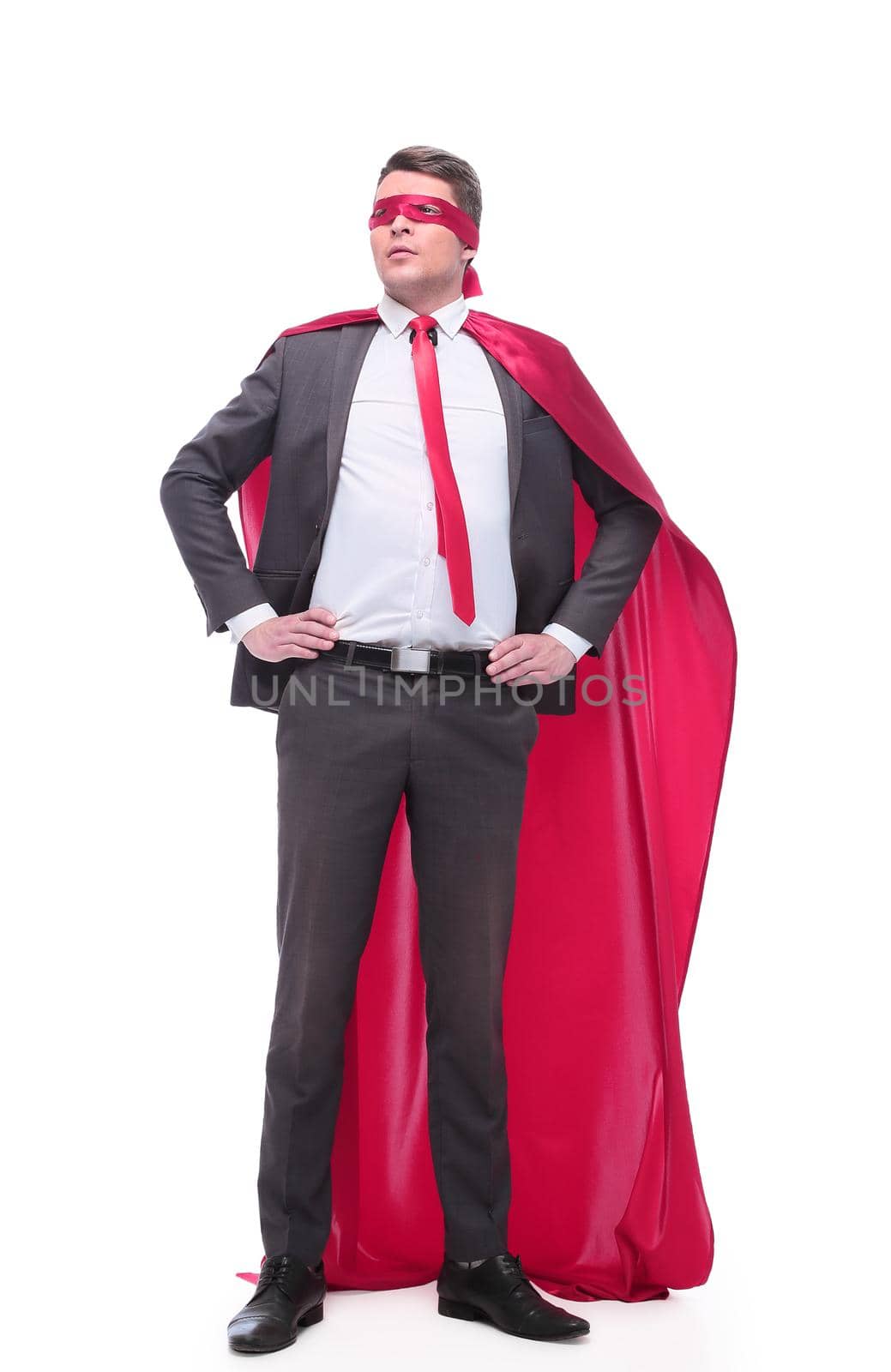 in full growth. responsible superhero businessman looking forward . isolated on white