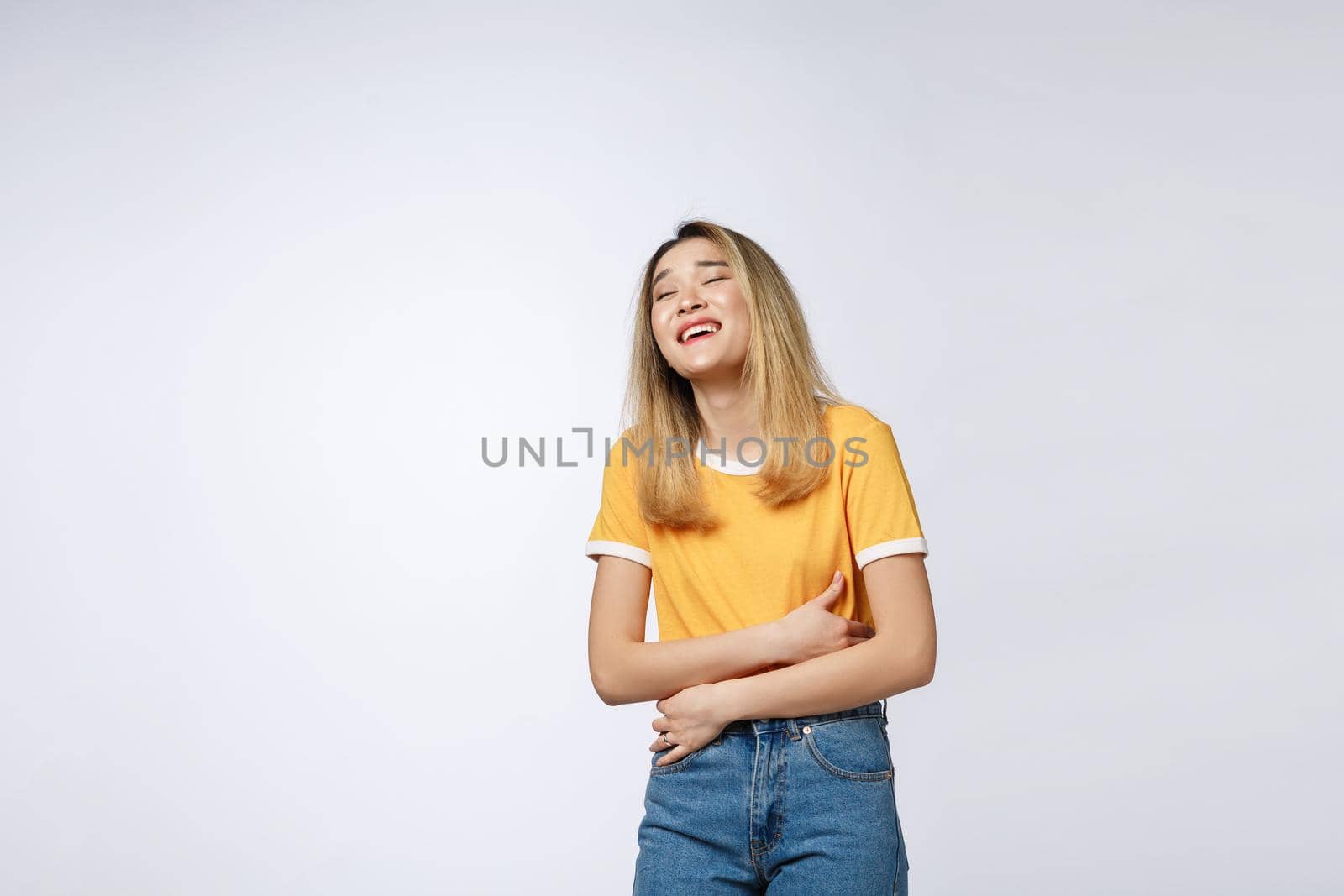 Young friendly Asian woman with smiley face isolated on white background