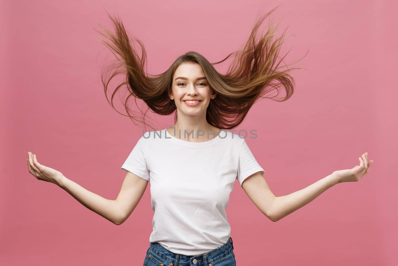 Portrait of crazy adorable young woman playing with her hairs. emotional girl isolated on white background by Benzoix